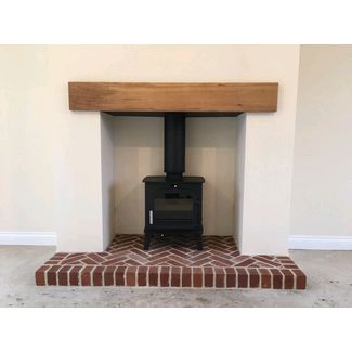 Brick hearth, plain opening and oak beam