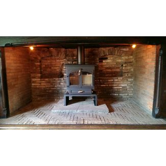 Clearview 650 flat top 12kw stove on 10 inch plinth in Inglenook fireplace