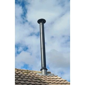 Black twin walled chimney system and lead flashing on a concrete tiled roof