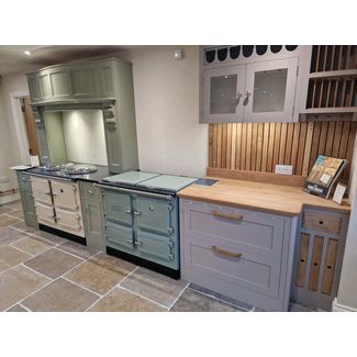 On the left is the Esse 1000T in cream and on the right is a Esse 1000X in Sage green. Both are all electric range cookers.