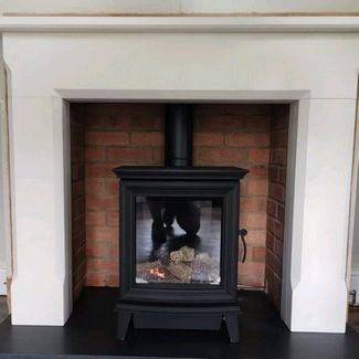 Capital fireplaces mantel, hearth and chamber set along with the Gazco chesterfield gas stove 